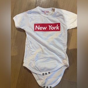White Baby Onesie with Red "New York" Graphic